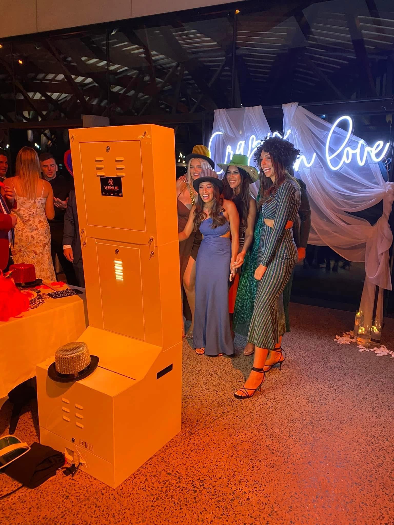 Guests enjoying the Venue Events Photo Booth at a wedding and formal event