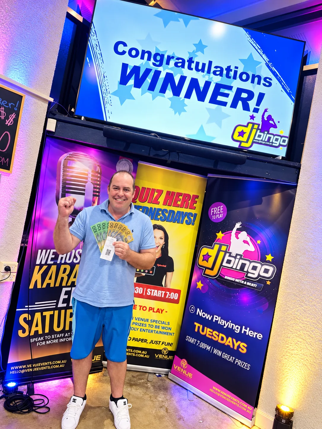 DJ Bingo winner celebrating with cash prize